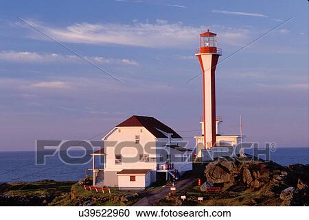 lighthouse, Nova Scotia, Yarmouth, NS, Canada, Cape Forchu Lighthouse along the coast in Yarmouth at sunrise on the Atlantic Ocean. View Large Photo Image Stock Image - lighthouse, Nova Scotia, Yarmouth, NS, Canada, Cape Forchu Lighthouse along the coast in Yarmouth at sunrise on the Atlantic Ocean. . Fotosearch