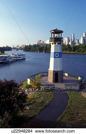 lighthouse, skyline, Minneapolis, MN, Minnesota, Twin Cities, Lighthouse and riverboats at Boom Island Park along the Mississippi River. Downtown skyline in the background. View Large Photo Image Picture - lighthouse, skyline, Minneapolis, MN, Minnesota, Twin Cities, Lighthouse and riverboats at Boom Island Park along the Mississippi River. Downtown skyline in the background.. Fotosearch