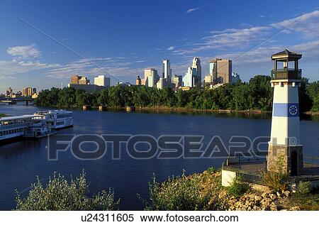 lighthouse, skyline, Minneapolis, MN, Minnesota, Twin Cities, Lighthouse and riverboats at Boom Island Park along the Mississippi River. Downtown skyline in the background. View Large Photo Image Stock Photography -  lighthouse, skyline, Minneapolis, MN, Minnesota, Twin Cities, Lighthouse and riverboats at Boom Island Park along the Mississippi River. Downtown skyline in the background.. Fotosearch