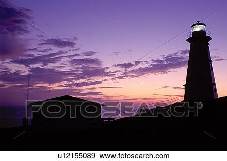 lighthouse, sunrise, sunset, Newfoundland, NF, Canada, Lighthouse at Cape Spear National Historic Site, Easternmost Point of North America at sunrise on the Atlantic Ocean. View Large Photo Image Stock Photo - lighthouse, sunrise, sunset, Newfoundland, NF, Canada, Lighthouse at Cape Spear National Historic Site, Easternmost Point of North America at sunrise on the Atlantic Ocean.. Fotosearch