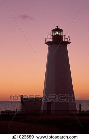 lighthouse, sunrise, sunset, Newfoundland, NF, Canada, Lighthouse at Cape Anguilla at sunset on the Gulf of St. Lawrence. View Large Photo Image Stock Photo - lighthouse, sunrise, sunset, Newfoundland, NF, Canada, Lighthouse at Cape Anguilla at sunset on the Gulf of St. Lawrence.. Fotosearch