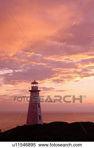 lighthouse, sunrise, sunset, Newfoundland, NF, Canada, Lighthouse at Cape Spear National Historic Site, Easternmost Point of North America at sunrise on the Atlantic Ocean. View Large Photo Image Stock Photography - lighthouse, sunrise, sunset, Newfoundland, NF, Canada, Lighthouse at Cape Spear National Historic Site, Easternmost Point of North America at sunrise on the Atlantic Ocean.. Fotosearch