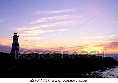 lighthouse, sunset, sunrise, Nova Scotia, Bay of Fundy, NS, Canada, Western Lighthouse at sunset along the coast of the Bay of Fundy on Briar Island on the Atlantic Ocean. View Large Photo Image Stock Photo - lighthouse, sunset, sunrise, Nova Scotia, Bay of Fundy, NS, Canada, Western Lighthouse at sunset along the coast of the Bay of Fundy on Briar Island on the Atlantic Ocean. . Fotosearch
