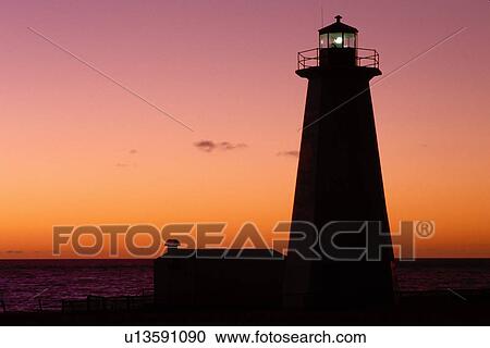 lighthouse, sunset, sunrise, Newfoundland, NF, Canada, Lighthouse at Cape Anguilla at sunset on the Gulf of St. Lawrence. View Large Photo Image Stock Image - lighthouse, sunset, sunrise, Newfoundland, NF, Canada, Lighthouse at Cape Anguilla at sunset on the Gulf of St. Lawrence.. Fotosearch