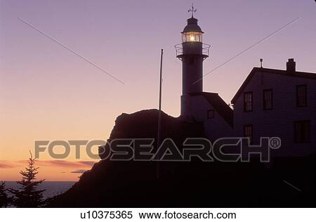 lighthouse, sunset, sunrise, Newfoundland, NF, Canada, Lobster Cove Head Lighthouse on the Gulf of St. Lawrence at sunset. Gros Morne National Park. View Large Photo Image Stock Photography - lighthouse, sunset, sunrise, Newfoundland, NF, Canada, Lobster Cove Head Lighthouse on the Gulf of St. Lawrence at sunset. Gros Morne National Park.. Fotosearch