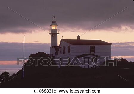 lighthouse, sunset, sunrise, Newfoundland, NF, Canada, Lobster Cove Head Lighthouse on the Gulf of St. Lawrence at sunset. Gros Morne National Park. View Large Photo Image Stock Photography - lighthouse, sunset, sunrise, Newfoundland, NF, Canada, Lobster Cove Head Lighthouse on the Gulf of St. Lawrence at sunset. Gros Morne National Park.. Fotosearch