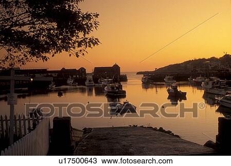 Stock Image -  lobster boats, sunrise, Rockport, MA, Massachusetts, Fishing boats docked in Rockport Harbor at sunrise in Rockport in the fall.. Fotosearch