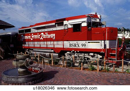 Stock Photograph -  locomotive, train, scenic railway, Branson, MO, Missouri, Red locomotive pulls the train at the Branson Scenic Railway in Branson.. Fotosearch