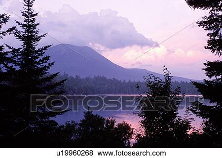 Maine, Baxter Park, ME, Scenic view of Mt. Katahdin from Daicey Pond at sunset in Baxter State Park. View Large Photo Image Stock Photo - Maine, Baxter Park, ME, Scenic view of Mt. Katahdin from Daicey Pond at sunset in Baxter State Park.. Fotosearch