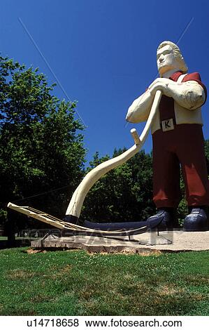 Stock Photo -  Manhattan, Flint Hills, KS, Kansas, A 30-foot statue of Johnny Kaw, a mythical Kansas wheat farmer at City Park.. Fotosearch