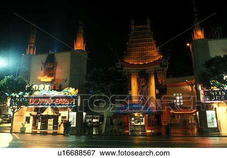 Stock Photo -  Mann's Chinese Theater, Hollywood, California, Los Angeles, CA, Mann's Chinese Theatre illuminated at night in Hollywood.. Fotosearch