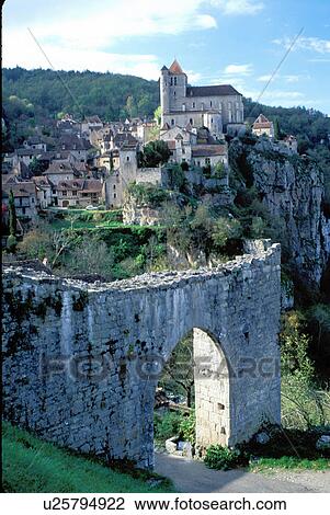 medieval, the Dordogne, Perigord, Quercy, France, Europe, Lot, Midi-Pyrenees, Saint Cirq-Lapapie, A medieval castle and village of Saint Cirq-Lapapie sit above the rocky cliffs.  View Large Photo Image Stock Image -  medieval, the Dordogne, Perigord, Quercy, France, Europe, Lot, Midi-Pyrenees, Saint Cirq-Lapapie, A medieval castle and village of Saint Cirq-Lapapie sit above the rocky cliffs. . Fotosearch