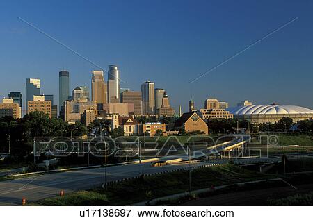 Stock Photo -  Minneapolis, MN, Minnesota, Twin Cities, Downtown skyline of Minneapolis and the Hubert H. Humphrey Metrodome . Fotosearch