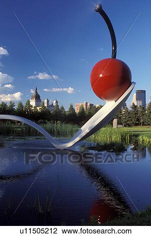 Stock Image -  Minnesota, Minneapolis, MN, Twin Cities, Spoonbridge and Cherry sculpture in the Minneapolis Sculpture Garden at the Walker Art Center in Minneapolis.. Fotosearch