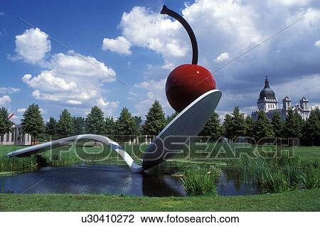Stock Image -  Minnesota, Minneapolis, MN, Twin Cities, Spoonbridge and Cherry sculpture in the Minneapolis Sculpture Garden at the Walker Art Center in Minneapolis.. Fotosearch