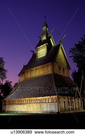 Stock Photo -  MN, Minnesota, Moorhead, Stave Church in the evening at the Heritage Hjemkomst Interpretive Center. Fotosearch