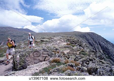 Stock Photo -  Mt. Katahdin, Maine, Appalachian Trail, Baxter Park, ME, hiking, People hiking the Tableland section of the Hunt Trail part of the Appalachian Trail on Mt. Katahdin in Baxter State Park. . Fotosearch