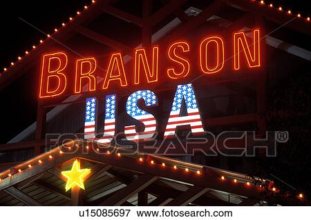 Stock Photo -  neon lights, Branson, MO, Missouri, Branson USA store is illuminated at night with neon lights in Branson.. Fotosearch
