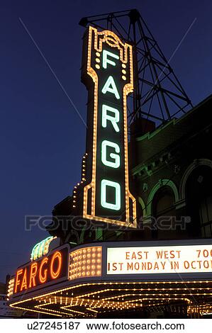 Stock Photo -  neon lights, theater, Fargo, ND, North Dakota, Fargo Theater illuminated at night with neon lights in downtown Fargo.. Fotosearch
