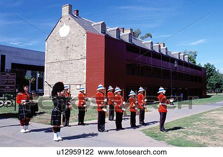 Stock Image -  New Brunswick, Fredericton, NB, Canada, Guards stand in formation outside the Soldiers Barracks at the Fredericton Military Compound. . Fotosearch