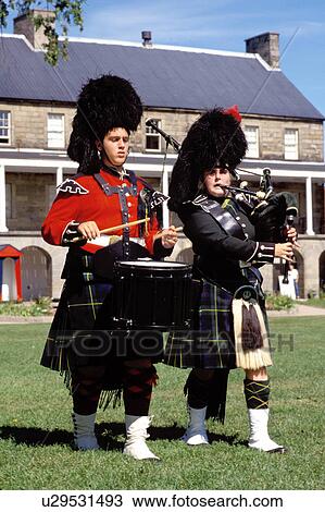 Stock Image -  New Brunswick, Fredericton, NB, Canada, Re-enactment of the Changing of the Guards at Officer's Square in Fredericton. Bagpipe and drummer. . Fotosearch