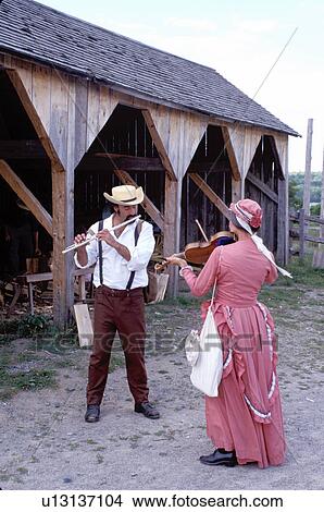 Picture -  New Brunswick, NB, Canada, Interpreters play music at the King's Landing Historical Settlement . Fotosearch