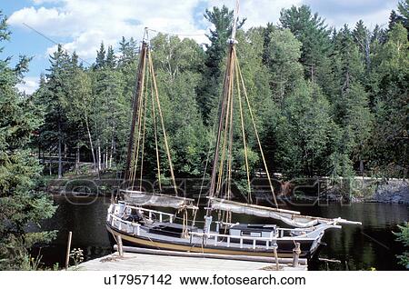 Stock Image -  New Brunswick, NB, Canada, The Brunswick Lion, a lumber boat, at the King's Landing Historical Settlement . Fotosearch