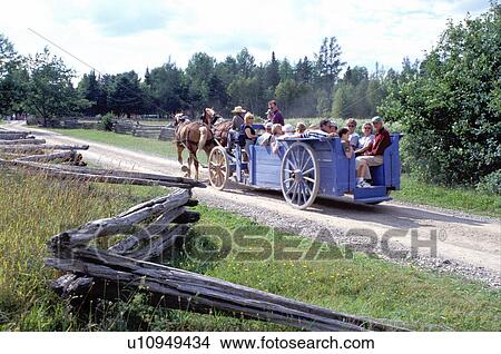 Picture -  New Brunswick, NB, Canada, Wagon rides at King's Landing Historical Settlement.. Fotosearch
