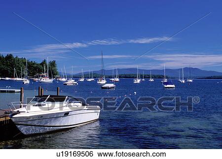 Stock Photograph -  New Hampshire, Glendale, NH, Boats buoyed at a marina on scenic Lake Winnipesaukee.. Fotosearch