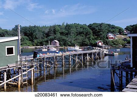 Stock Image -  New Harbor, Maine, ME, Pemaquid, Docks and fishing boats in the harbor. . Fotosearch