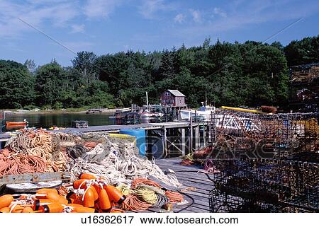 New Harbor, Maine, ME, Pemaquid, Fishing nets, lobster traps and buoys on a dock in the harbor. View Large Photo Image Stock Photo - New Harbor, Maine, ME, Pemaquid, Fishing nets, lobster traps and buoys on a dock in the harbor. . Fotosearch