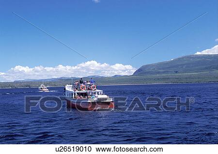 Stock Image -  Newfoundland, NF, Canada, Tourists on the tour boat at Western Brook Pond in Gros Morne National Park. . Fotosearch