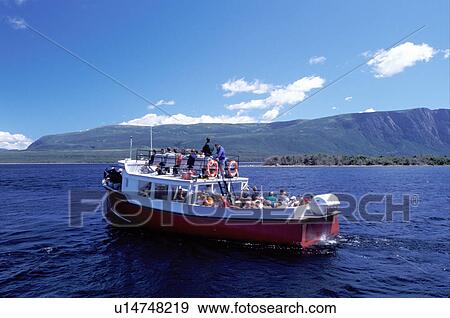Stock Photo -  Newfoundland, NF, Canada, Tourists on the tour boat at Western Brook Pond in Gros Morne National Park. . Fotosearch