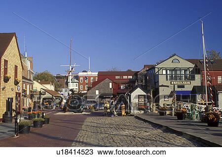 Stock Image -  Newport, Rhode Island, RI, Shops along the cobblestone street at Bowen's Wharf in Newport in the autumn.. Fotosearch
