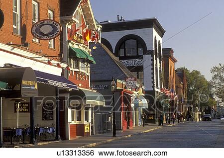 Stock Photograph -  Newport, Rhode Island, RI, Shops along Thames Street in downtown Newport in the autumn.. Fotosearch