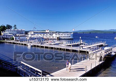 Stock Image -  NH, Weirs Beach, New Hampshire, boardwalk, M. S. Mt. Washington Cruise Boat on Lake Winnipesaukee.. Fotosearch