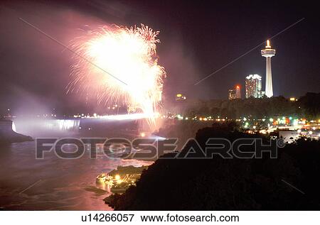Stock Photo -  Niagara Falls, fireworks, Canada/USA, Ontario, NY, New York, Firework display over Niagara Falls at night.. Fotosearch