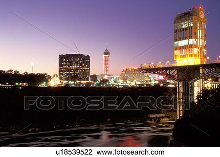 Stock Image -  Niagara Falls, New York, NY, Prospect Point Observation Tower at night at Niagara Falls. Ontario, Canada across the Niagara River.. Fotosearch