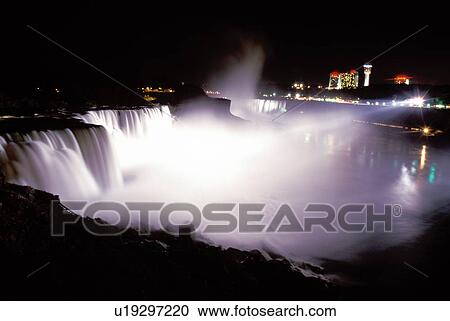 Stock Image -  Niagara Falls, New York, NY, waterfall, American Falls illuminated at night at Niagara Falls. . Fotosearch
