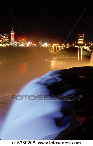 Stock Photo -  Niagara Falls, New York, NY, waterfall, American Falls illuminated at night at Niagara Falls. . Fotosearch