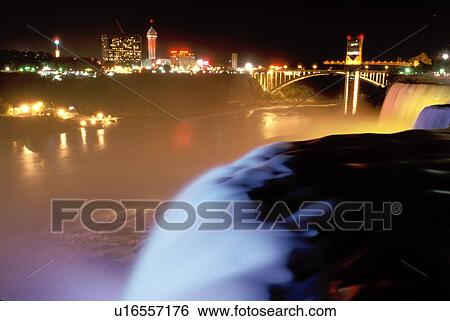 Stock Photograph -  Niagara Falls, New York, NY, waterfall, American Falls illuminated at night at Niagara Falls. . Fotosearch