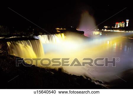 Stock Image -  Niagara Falls, NY, waterfalls, illumination, New York, American Falls illuminated at night at Niagara Falls. . Fotosearch
