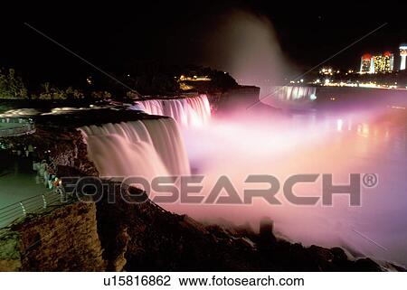 Stock Image -  Niagara Falls, NY, waterfalls, illumination, New York, American Falls illuminated at night at Niagara Falls. . Fotosearch