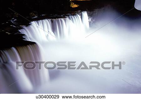 Niagara Falls, waterfalls, New York, NY, American Falls illuminated at night at Niagara Falls. View Large Photo Image Stock Photo - Niagara Falls, waterfalls, New York, NY, American Falls illuminated at night at Niagara Falls. . Fotosearch