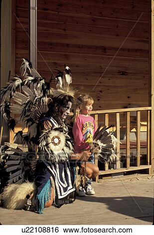 North Carolina, NC, Cherokee, A child poses with a Cherokee Indian in front of a shop in Cherokee Indian Reservation. View Large Photo Image Stock Photograph - North Carolina, NC, Cherokee, A child poses with a Cherokee Indian in front of a shop in Cherokee Indian Reservation.. Fotosearch