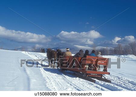 open sleigh ride, Stowe, Vermont, VT, A team of horses pulls a red sleigh through the snow covered field at Trapp Family Lodge in Stowe. View Large Photo Image Stock Image - open sleigh ride, Stowe, Vermont, VT, A team of horses pulls a red sleigh through the snow covered field at Trapp Family Lodge in Stowe.. Fotosearch