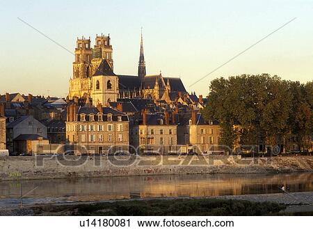 Stock Image -  Orleans, France, Loire Valley Castle Region, Loiret, Centre, Europe, A view of the town of Orleans from the Loire River at sunset.. Fotosearch