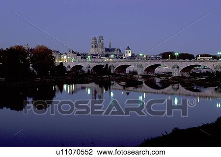 Orleans, Loire Valley, France, Loire Castle Region, Loiret, Centre, Europe, Reflection of the town of Orleans and the stone bridge in the Loire River in the evening. View Large Photo Image Stock Image - Orleans, Loire Valley, France, Loire Castle Region, Loiret, Centre, Europe, Reflection of the town of Orleans and the stone bridge in the Loire River in the evening.. Fotosearch