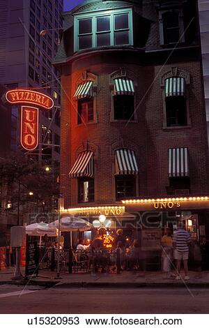 outdoor cafT, downtown, Chicago, Illinois, IL, People dining outside Uno's Pizzeria in downtown Chicago in the evening. View Large Photo Image Stock Image - outdoor cafT, downtown, Chicago, Illinois, IL, People dining outside Uno's Pizzeria in downtown Chicago in the evening.. Fotosearch