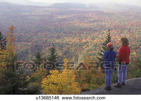 overlook, aerial, fall, hiking, Groton State Forest, VT, Vermont, Mother and daughter look out over the colorful fall foliage of the forest from Owl's Head Overlook in Groton State Forest in the autumn. View Large Photo Image Stock Photograph - overlook, aerial, fall, hiking, Groton State Forest, VT, Vermont, Mother and daughter look out over the colorful fall foliage of the forest from Owl's Head Overlook in Groton State Forest in the autumn.. Fotosearch